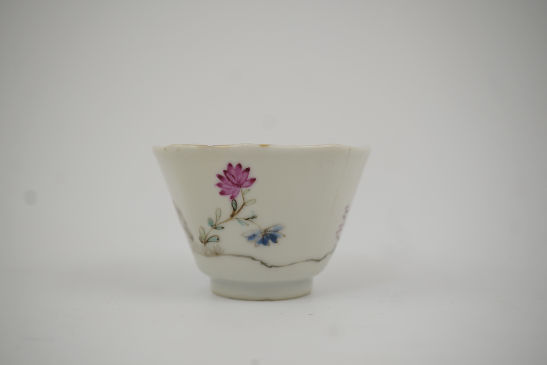 Two Chinese semi-eggshell porcelain hexagonal saucers and a similar cup, Yongzheng/Qianlong period